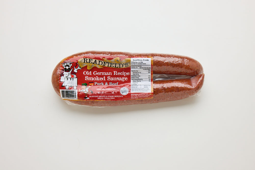 Packaged sausage with a label on a white background