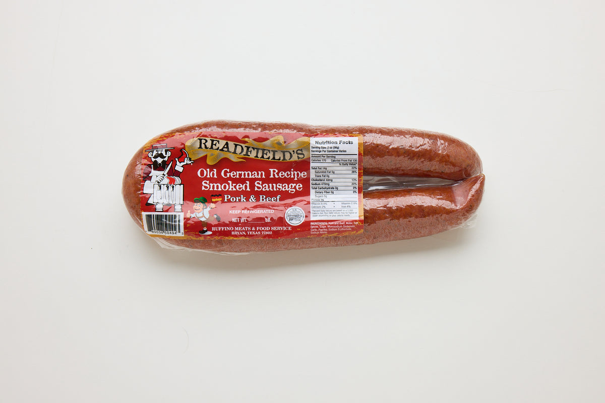 Packaged sausage with a label on a white background